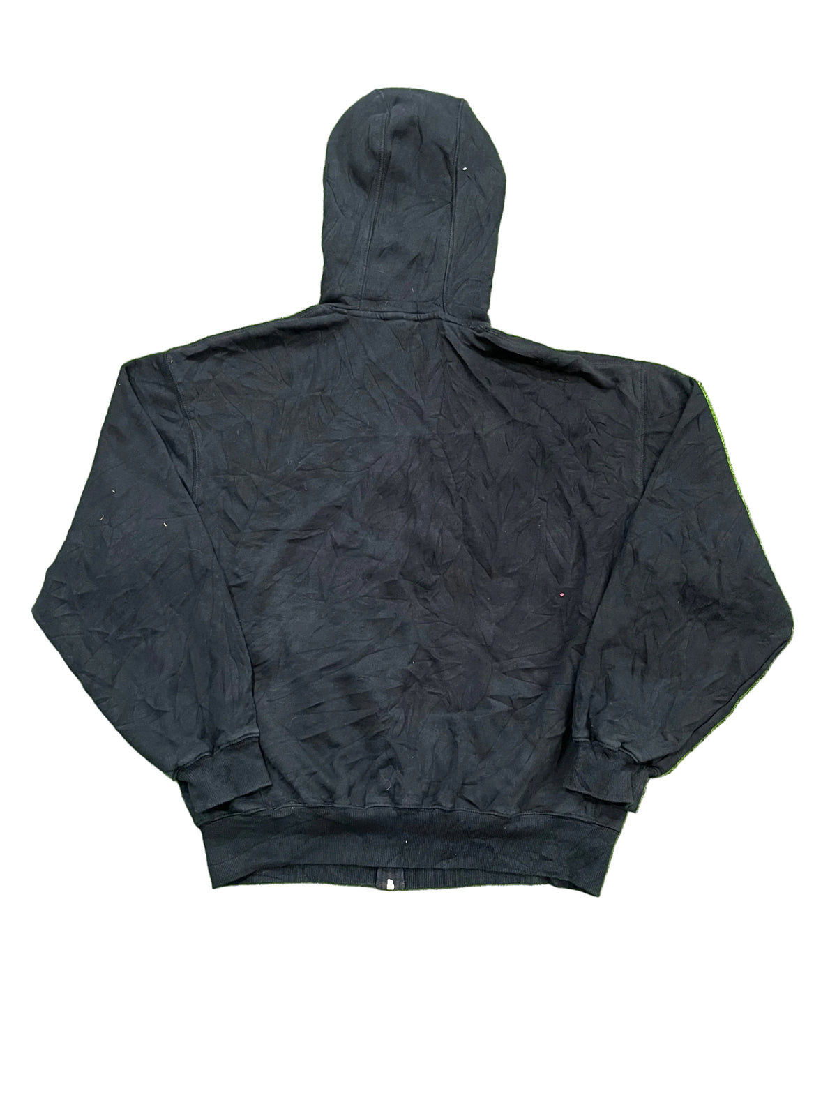 A black hooded jacket with bare feet visible at the bottom edge of the fra