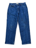 A pair of blue denim jeans The brand name 'L'EAU' is visible on the inner waistband label.