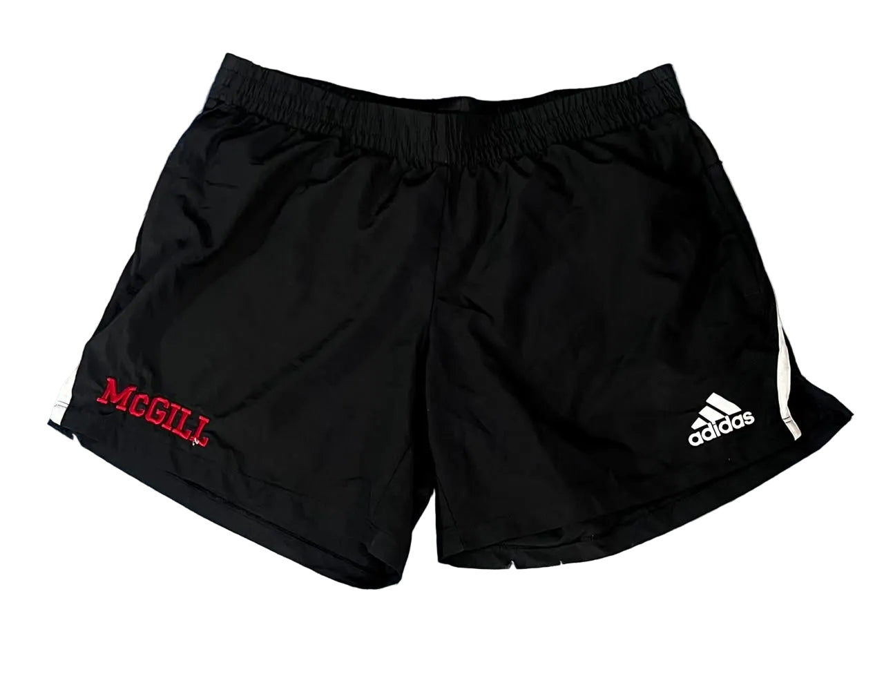 Black athletic shorts with an elastic waistband, featuring a red 'MCGILL' logo on the left side and a white Adidas logo on the right side,.