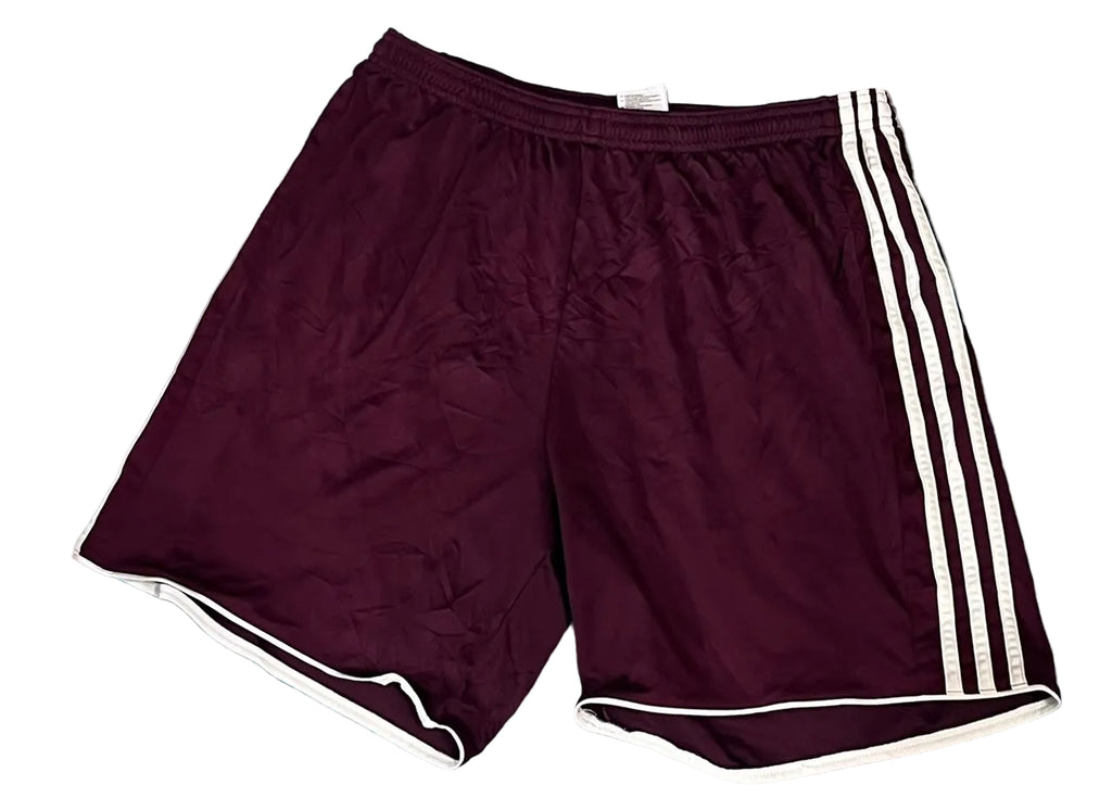 A pair of vintage burgundy athletic shorts with white three-stripes on the side and white piping on the hem,