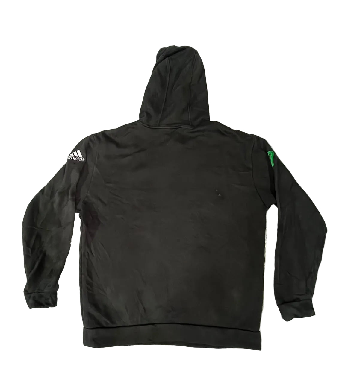 A black Adidas hoodie is  showing the back view with a white Adidas logo on the right sleeve and a small green tag on the left sleeve.