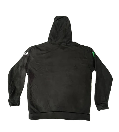 A black Adidas hoodie is  showing the back view with a white Adidas logo on the right sleeve and a small green tag on the left sleeve.
