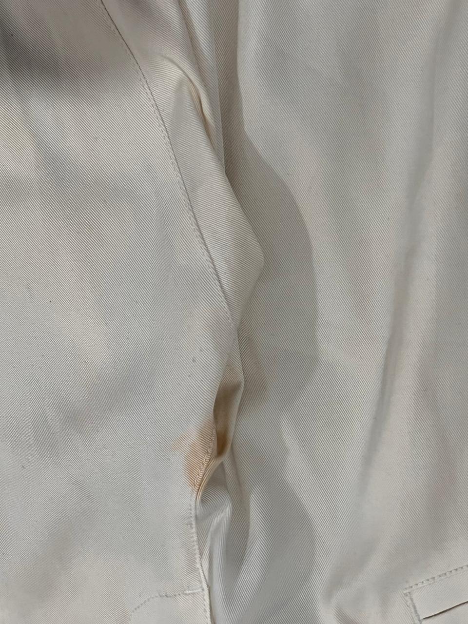 Close-up of beige fabric with a stain