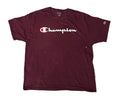 A maroon Champion short-sleeve t-shirt with a white script logo across the chest.