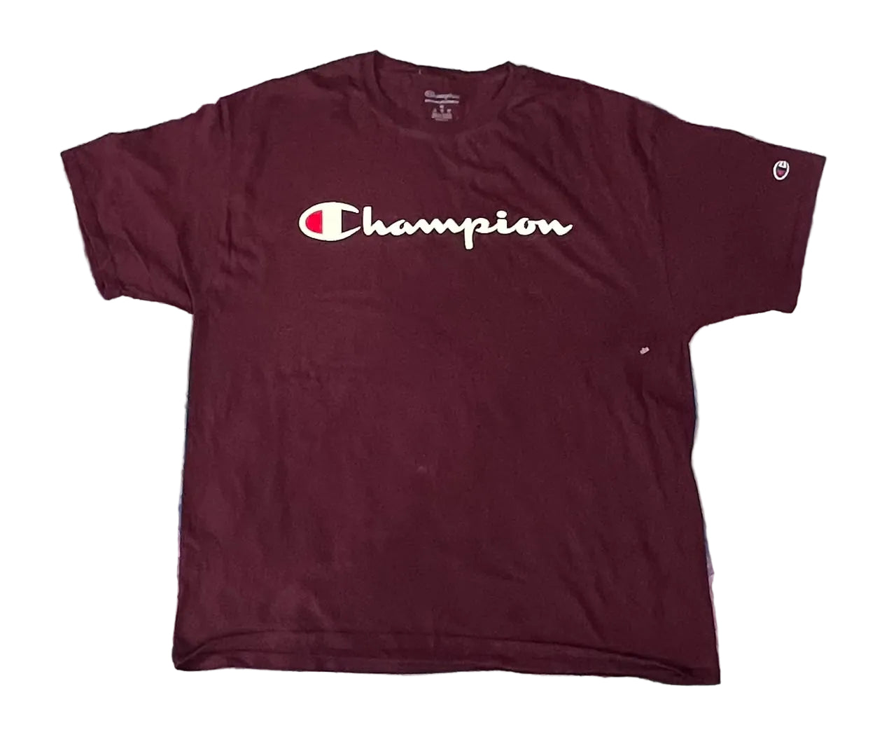A maroon Champion short-sleeve t-shirt with a white script logo across the chest.