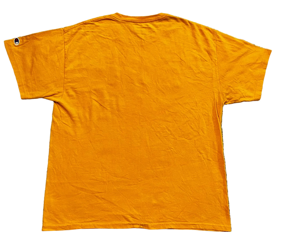 An orange short-sleeve t-shirt  showing the back side with a small black tag on the left sleeve.