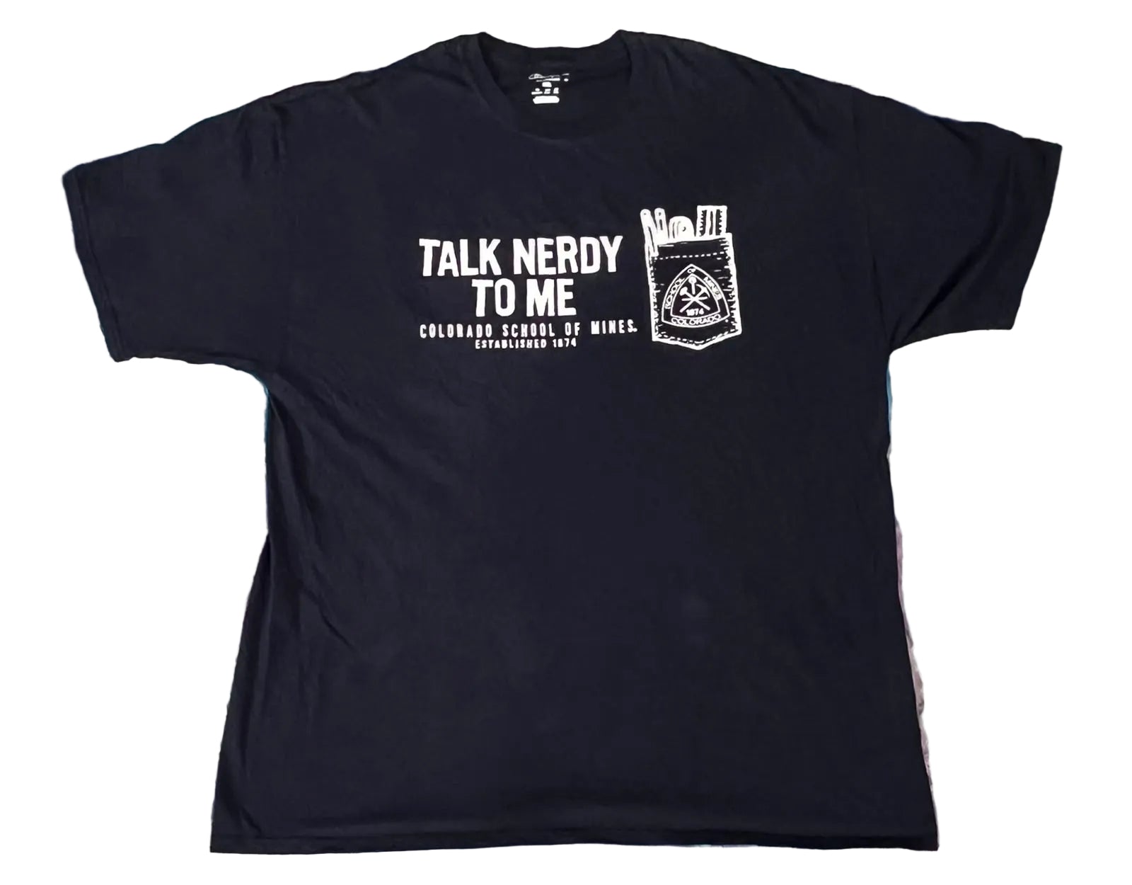 A black short-sleeve graphic t-shirt lThe shirt features a white graphic print on the front with the text 'TALK NERDY TO ME', 'COLORADO SCHOOL OF MINEA', and a stylized pocket graphic.