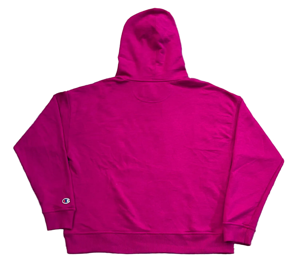 A bright magenta pink hoodie. The back of the hoodie is shown, featuring a small embroidered Champion logo on the left cuff.
