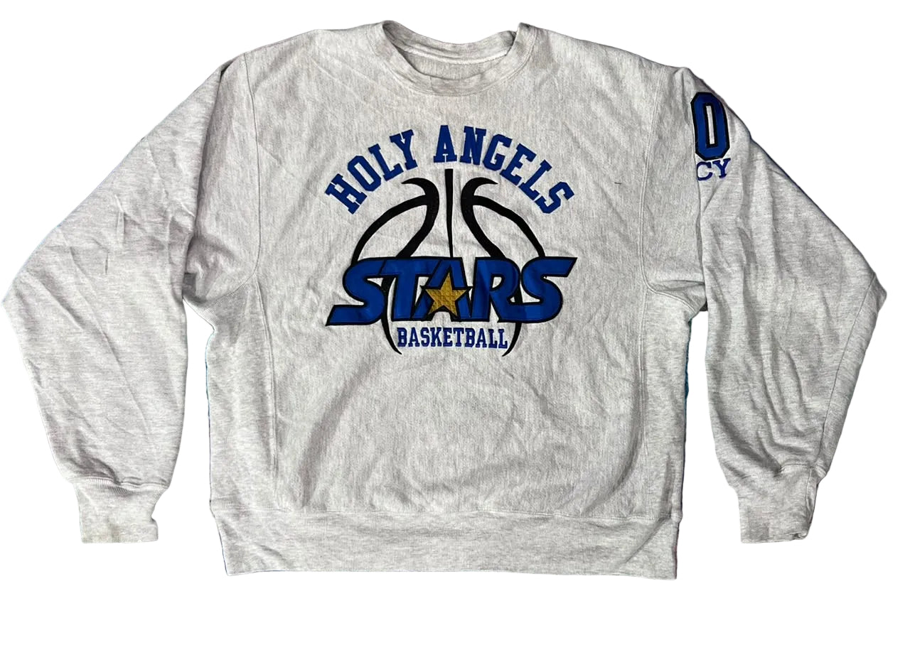 A light heather gray crewneck sweatshirt featuring a 'Holy Angels Stars Basketball' graphic on the front