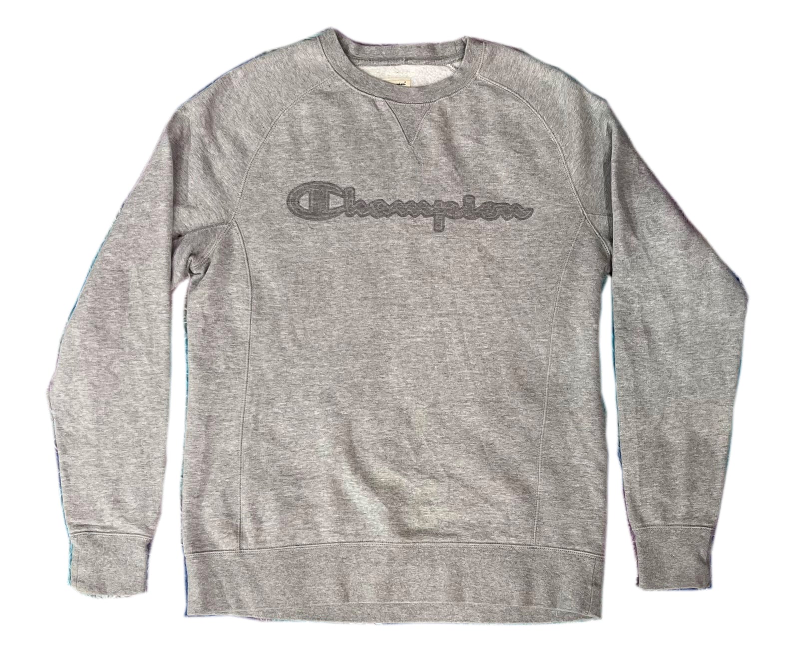 A heather gray crewneck sweatshirt with a dark gray embroidered Champion logo across the chest, displayed flat against a white background.
