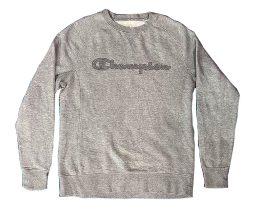 A heather gray crewneck sweatshirt with a dark gray embroidered Champion logo across the chest, displayed flat against a white background.
