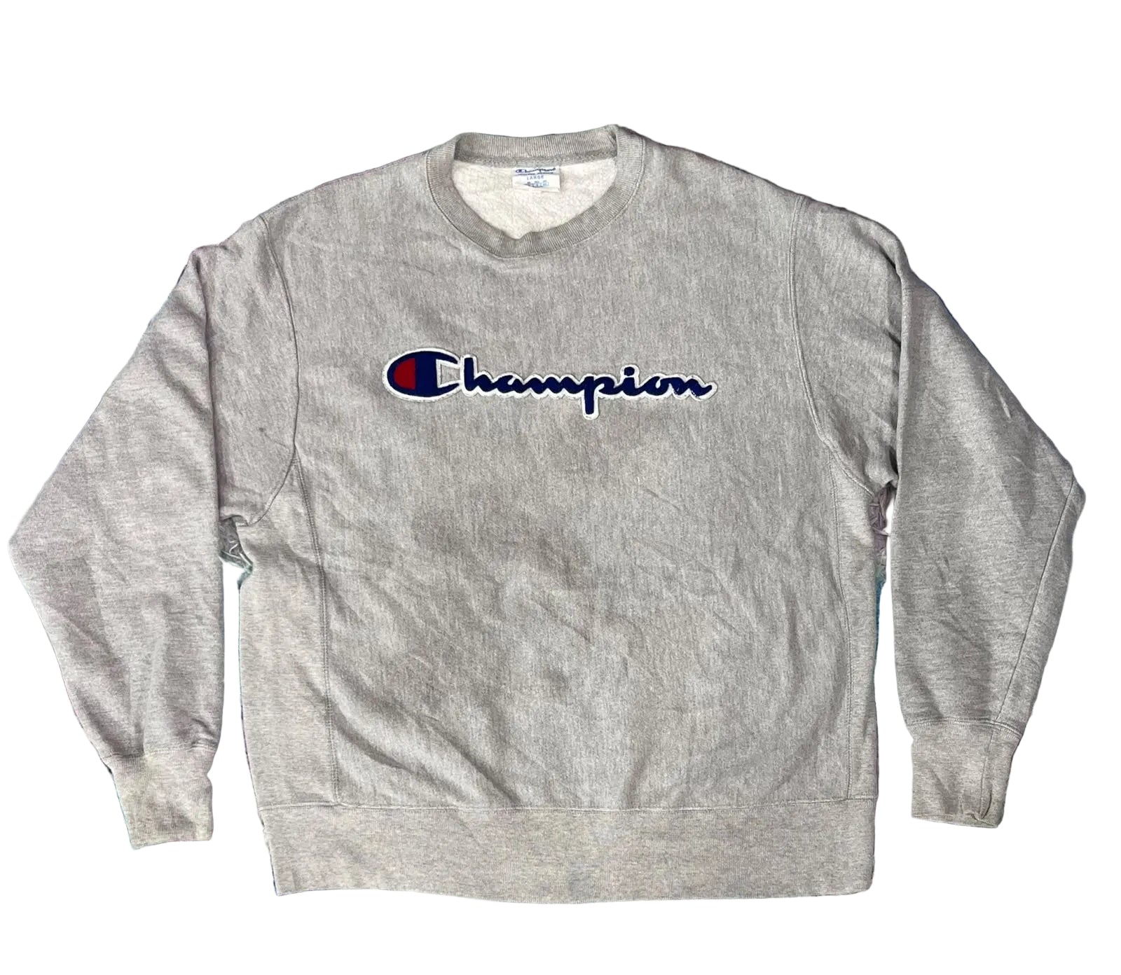 A heather gray crewneck sweatshirt with the embroidered Champion logo on the chest