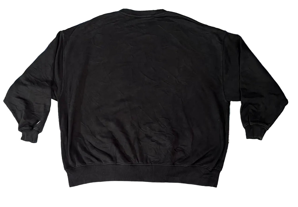 A black crewneck sweatshirt on  a white plain backghround 