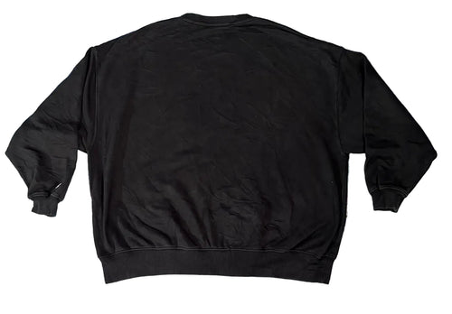A black crewneck sweatshirt on  a white plain backghround 