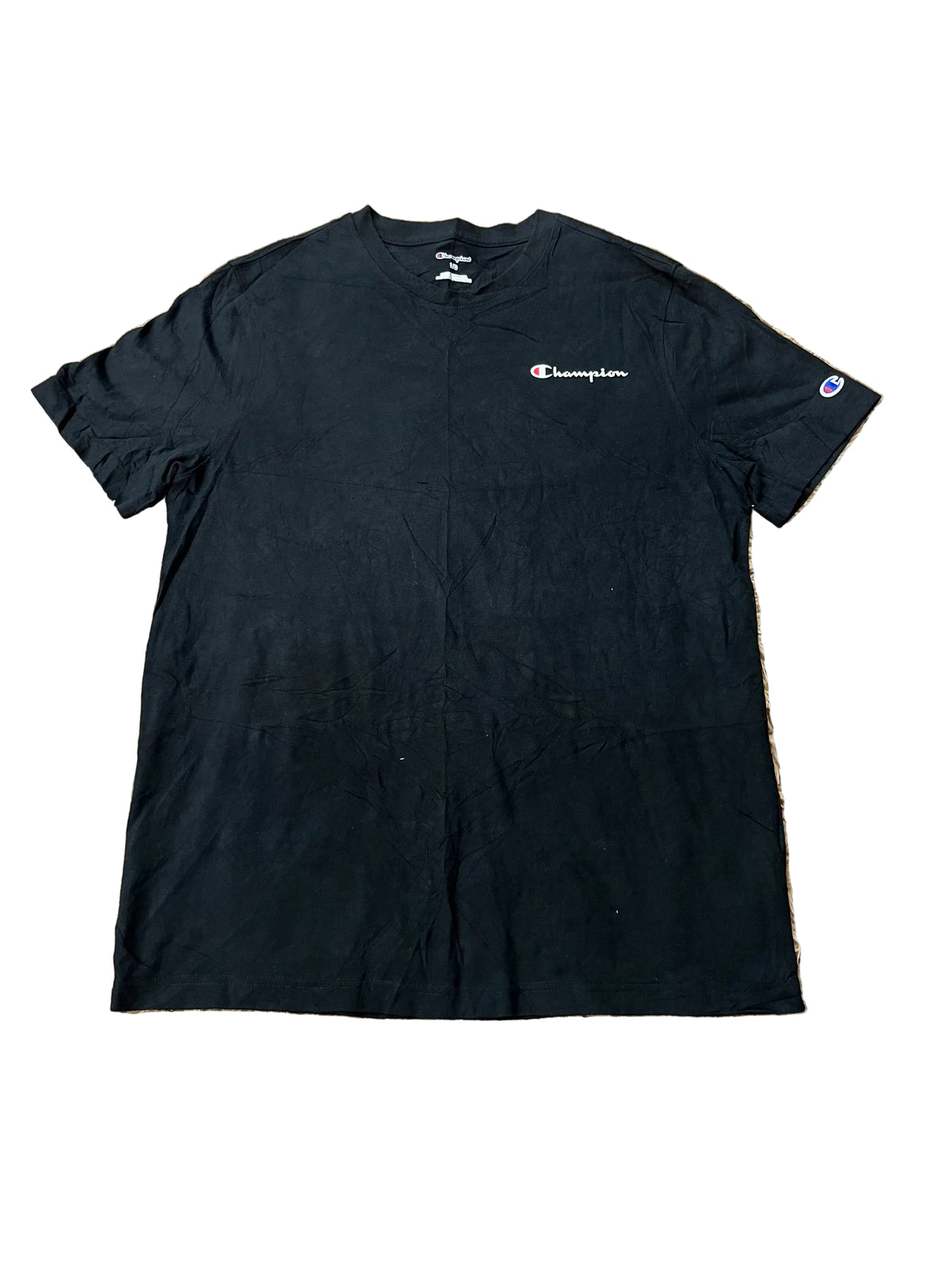 A black Champion short-sleeve t-shirt  featuring the Champion logo on the left chest and a small logo patch on the right sleeve.