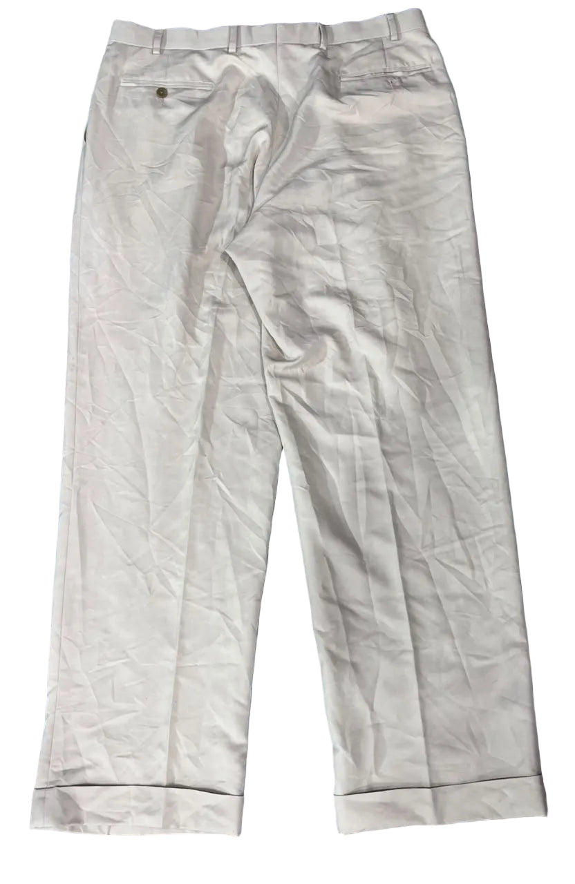 A pair of light beige or off-white chino pants CHAPS