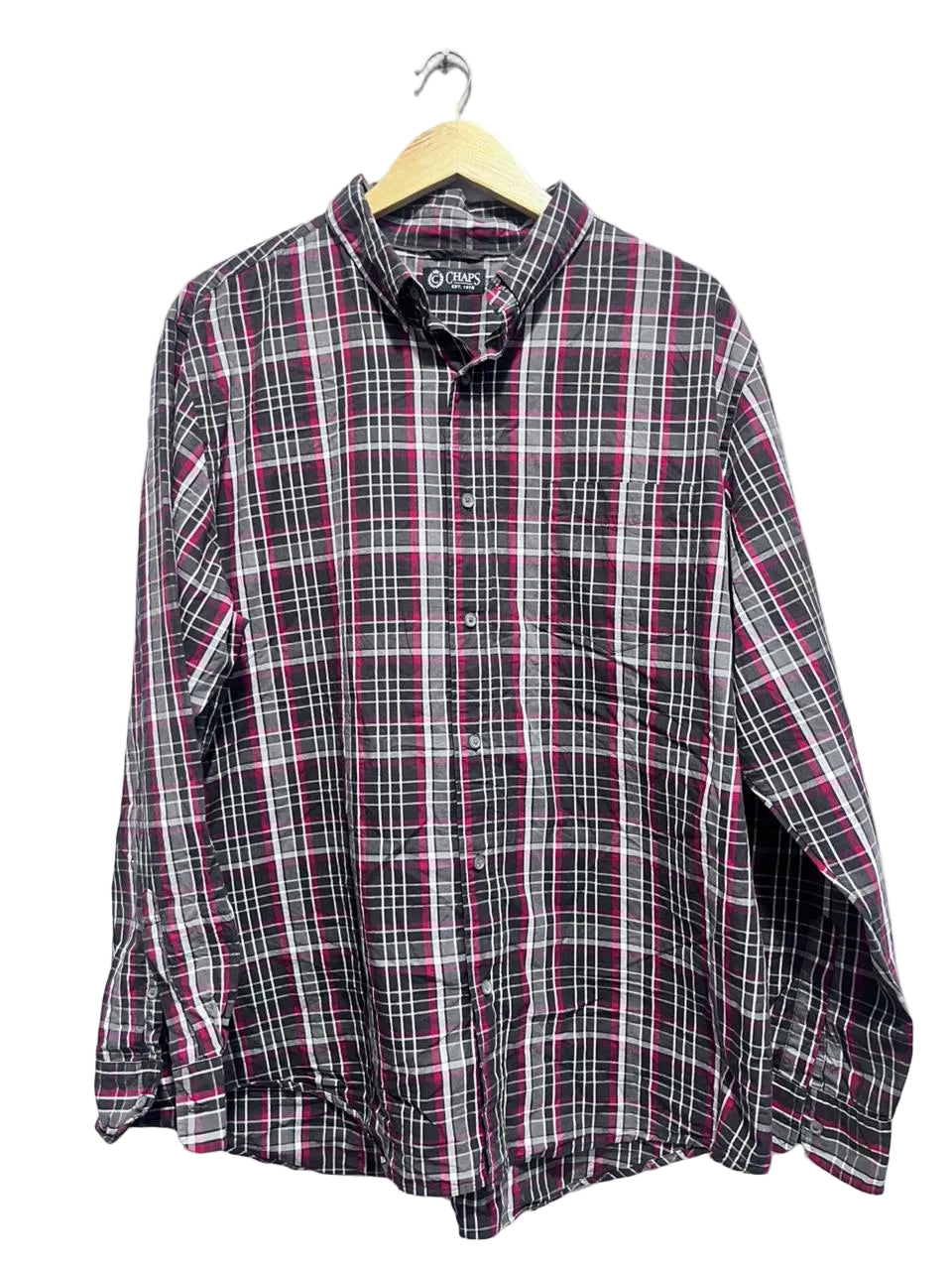 Chaps men plaid shirt on a hanger against a white wall