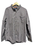 Chaps Men shirt on a hanger against a white wall