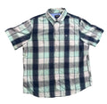 A short-sleeve plaid button-up shirt . The shirt features a pattern of black, gray, and light mint green plaid with thin white lines.