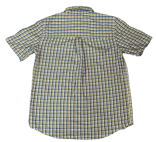 A short-sleeve plaid button-up shirt. The shirt features a yellow, blue, and white checkered pattern.