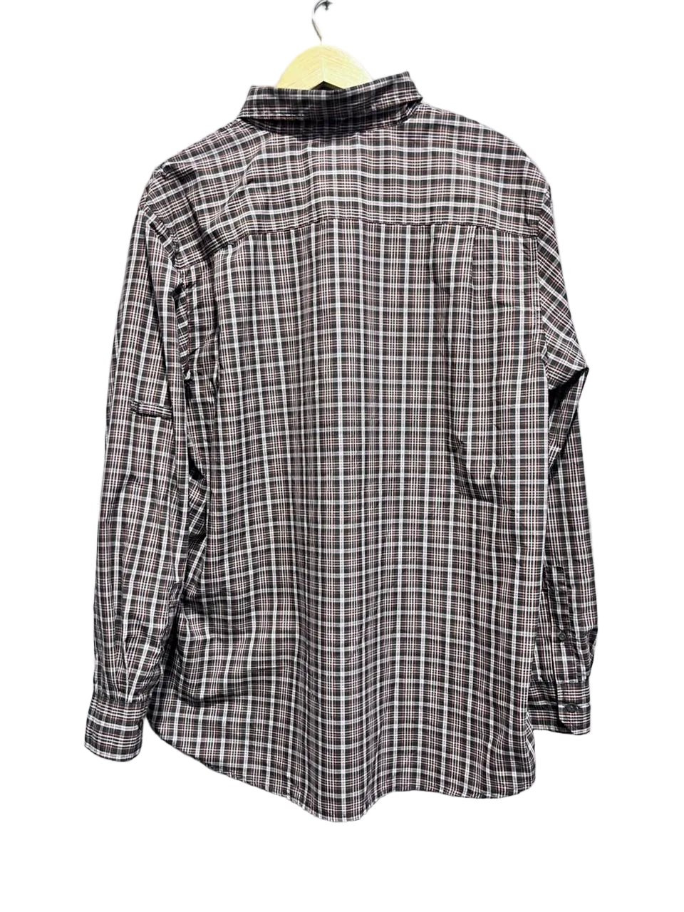 Plaid shirt on a hanger with white background
