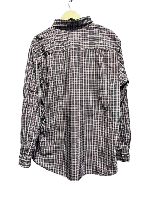 Plaid shirt on a hanger with white background