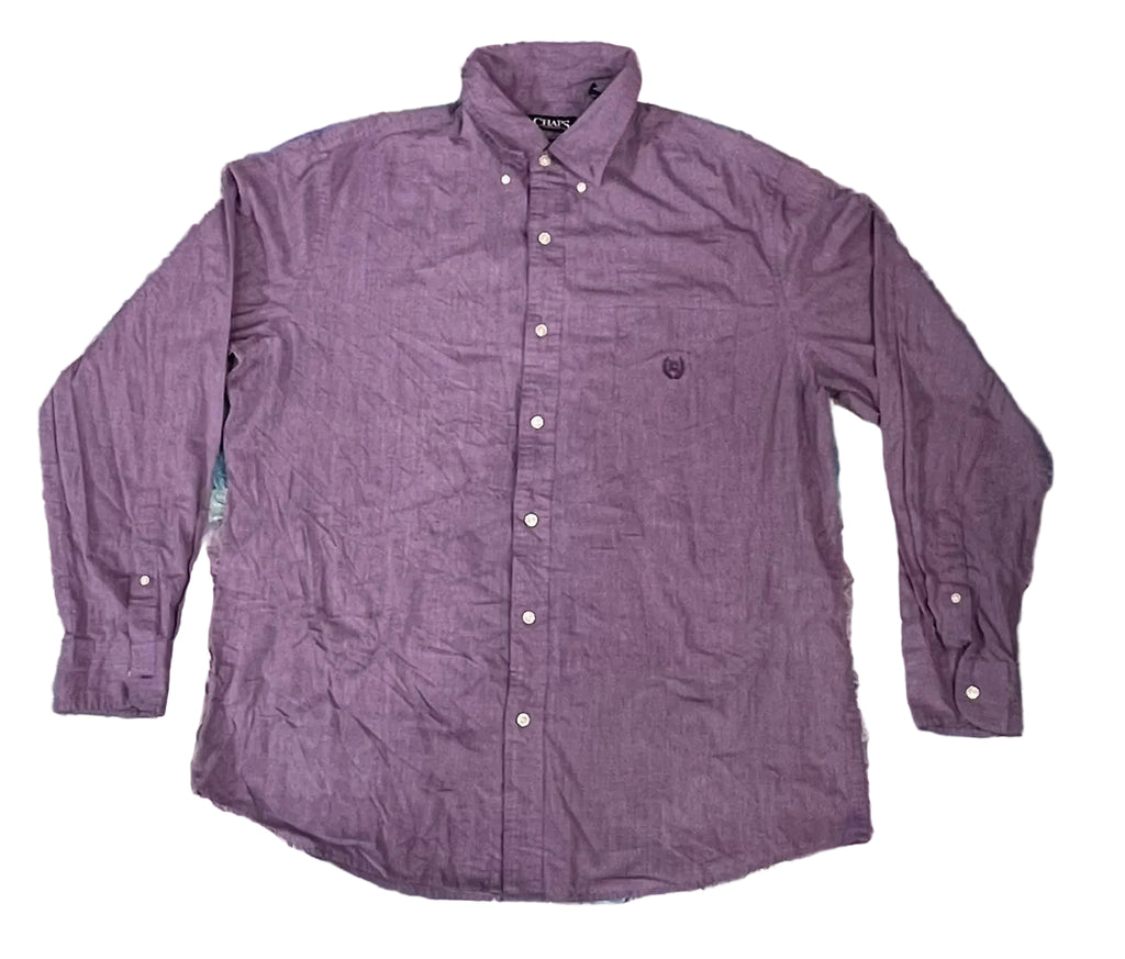 A purple long-sleeve button-down shirt. The shirt features a small embroidered shield logo on the left chest, which is the signature logo of the brand Pique.