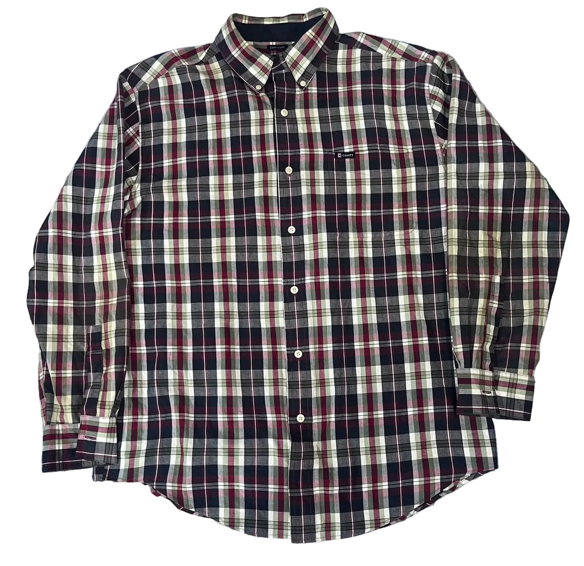 A long-sleeve button-up plaid shirt  The shirt features a navy, red, and cream plaid pattern with a small black brand tag on the left chest pocket.