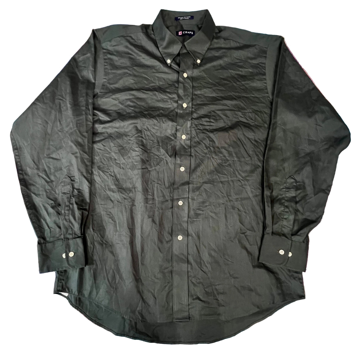 A black long-sleeve button-down shirt The shirt has a pointed collar, matching button-down front, and button cuffs.