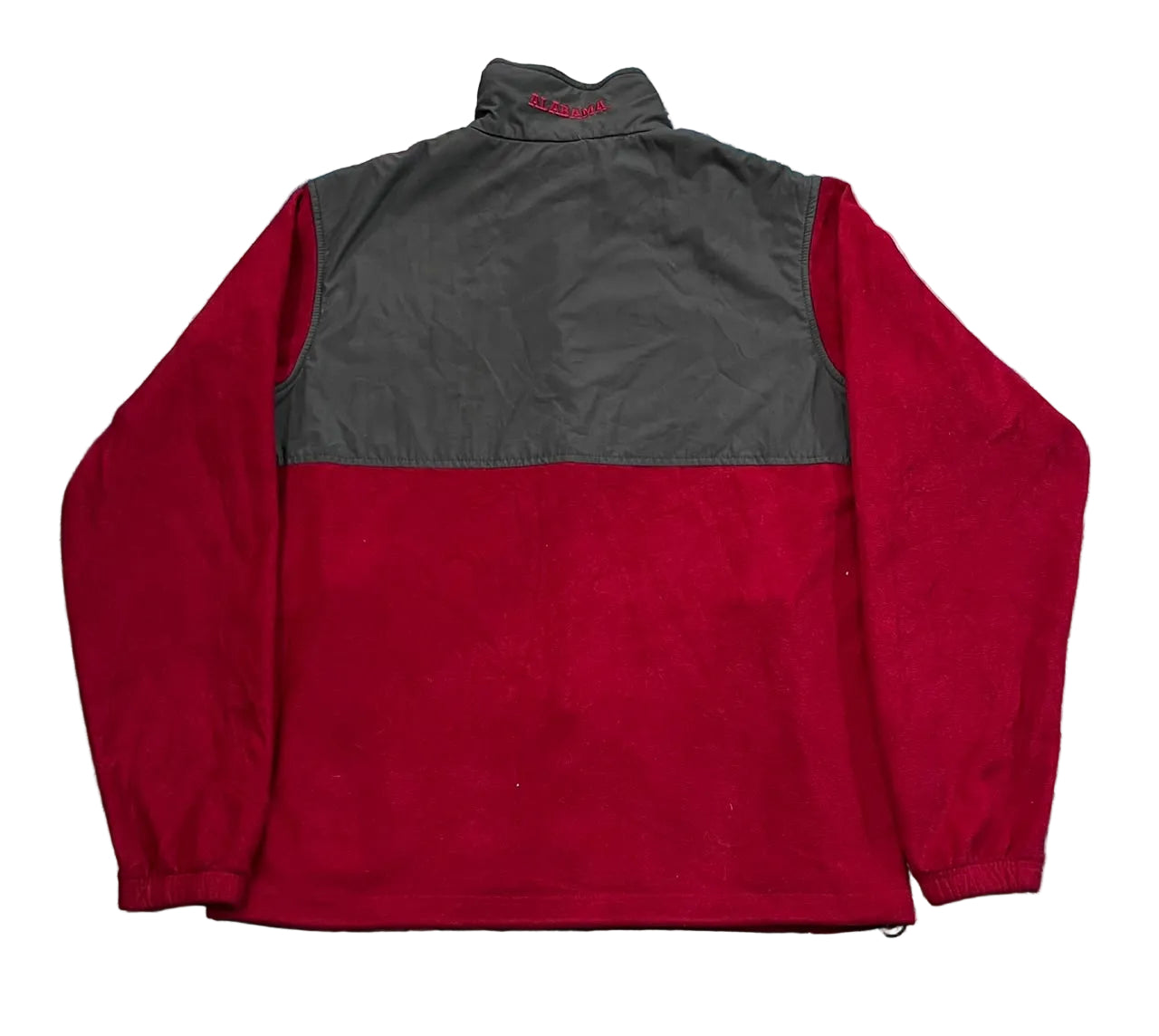 A colorblock quarter-zip pullover jacket with a dark gray upper section and a red lower body,