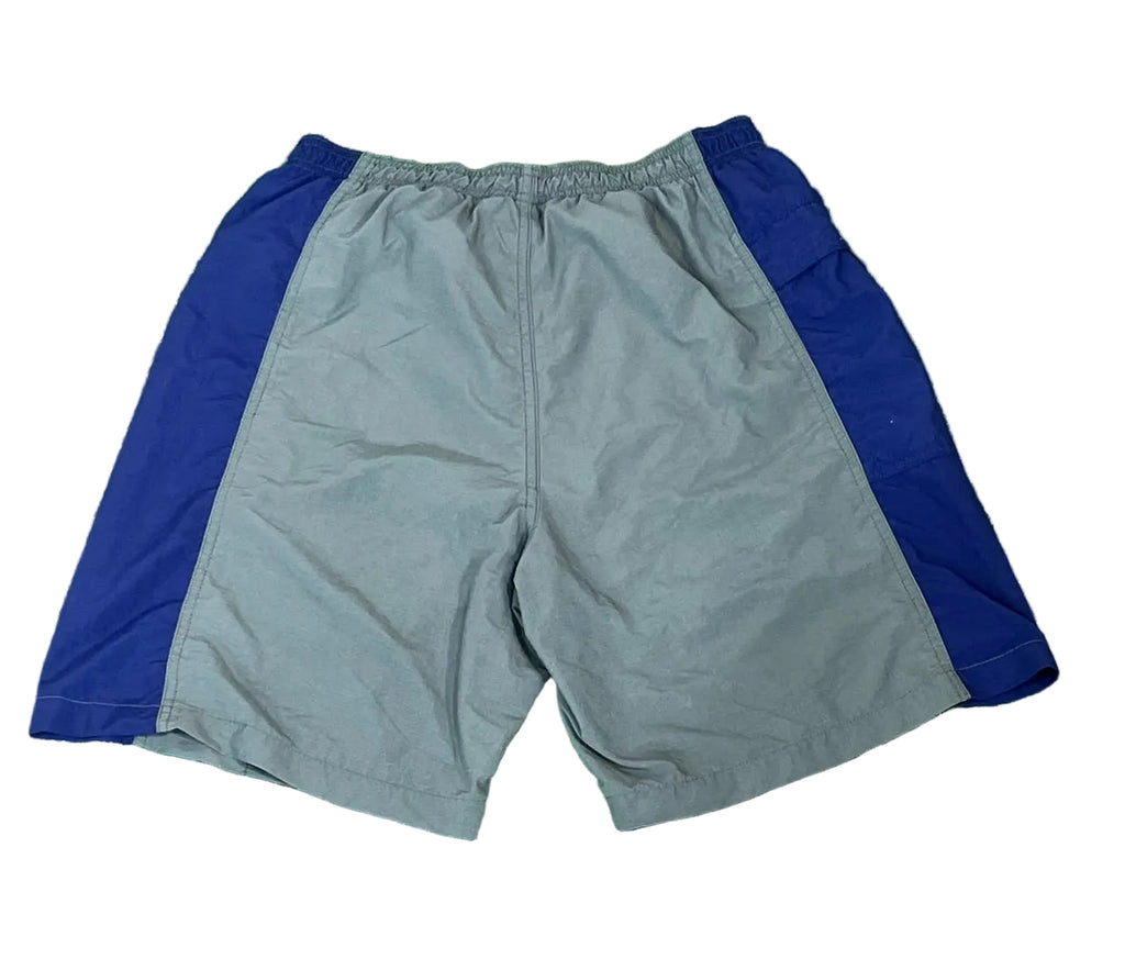 Gray athletic shorts with royal blue side panels