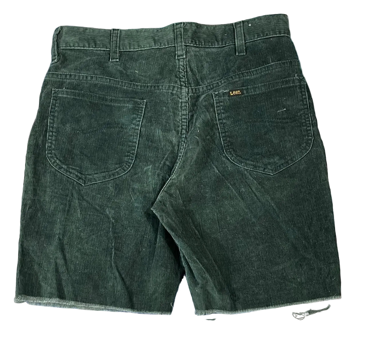 A pair of dark green corduroy shorts shown from the back,  The brand name 'CARE' is visible on a small gold tag on the right back pocket.