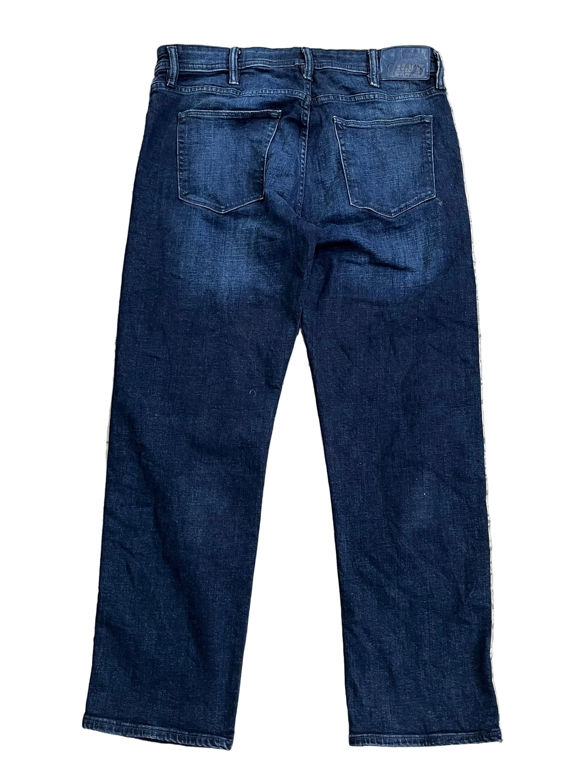 A pair of dark blue denim jeans shown from the back,