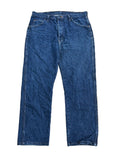 A pair of dark blue denim jeans ON THE WHITE BACKGROUND