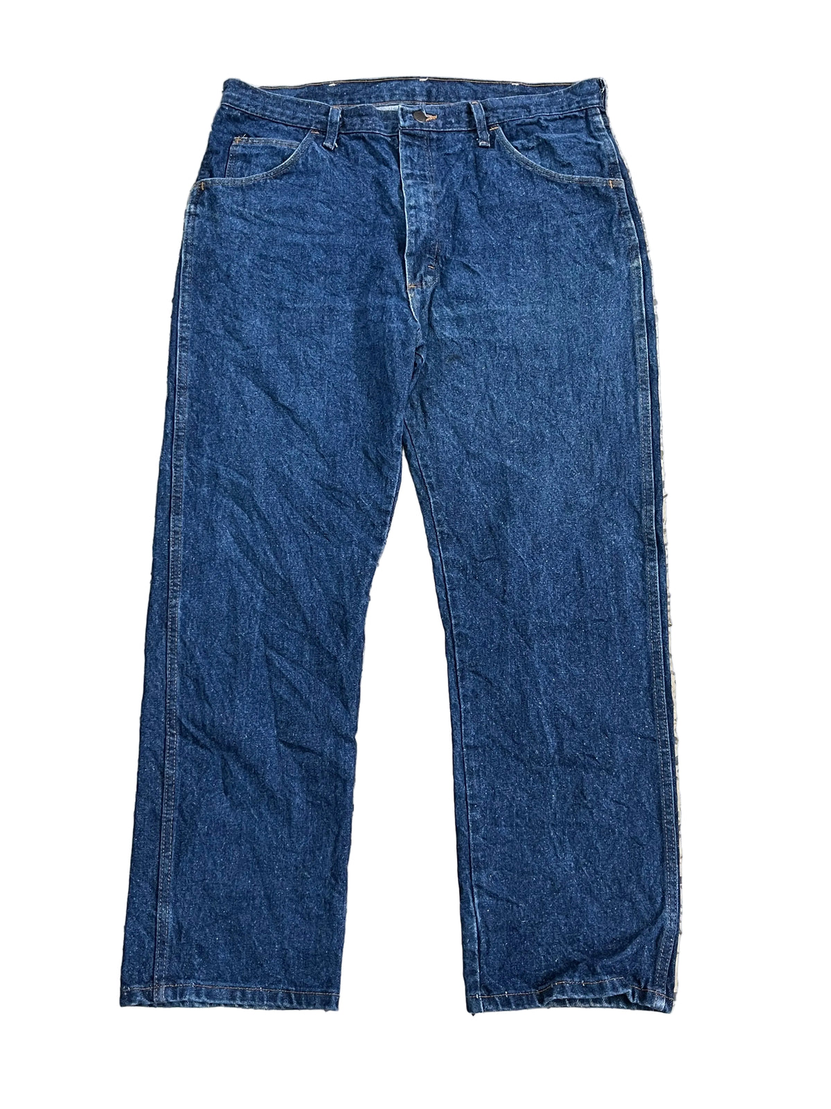 A pair of dark blue denim jeans ON THE WHITE BACKGROUND