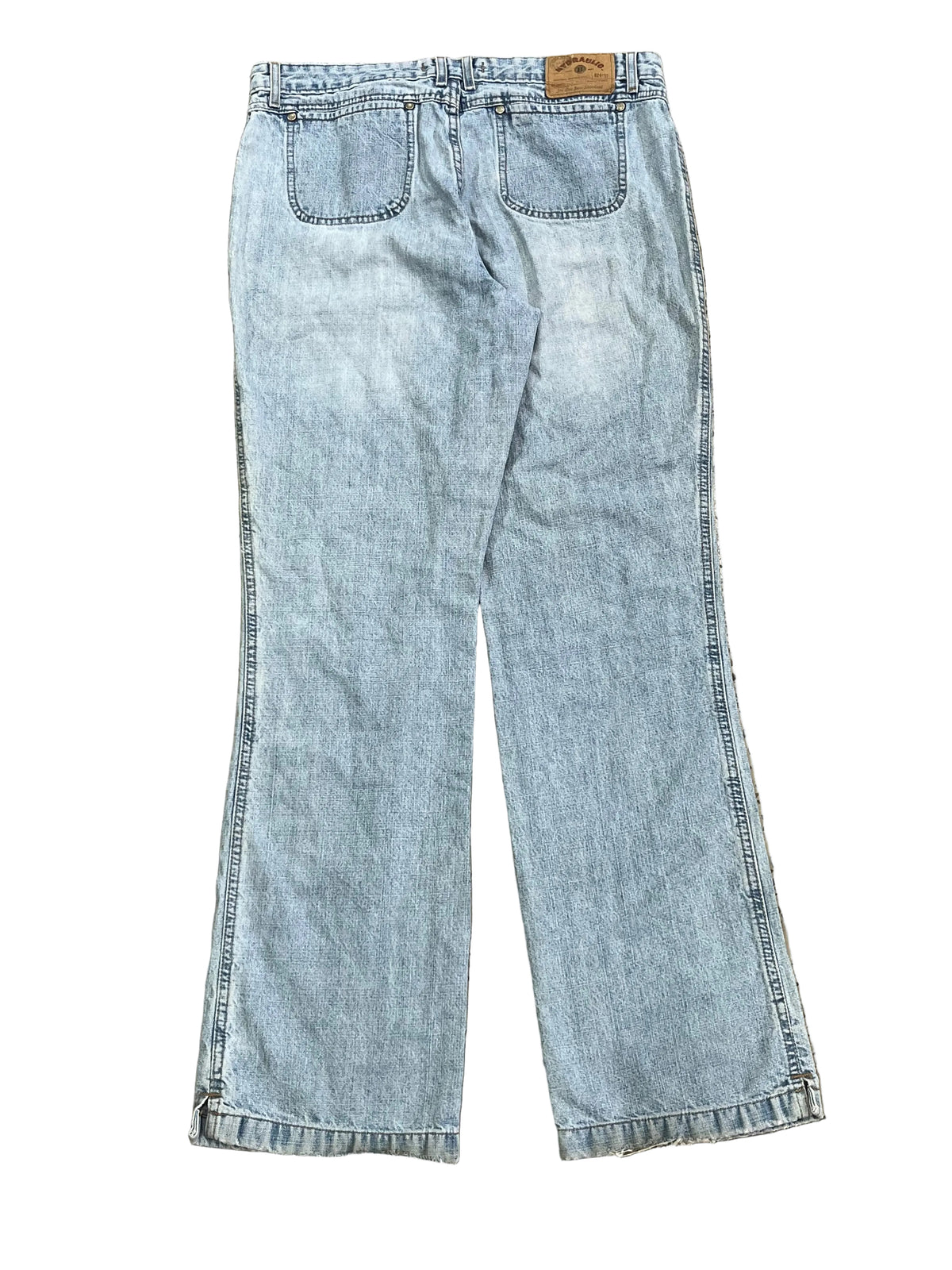 Light wash blue denim jeans, showing the back pockets and waistband.