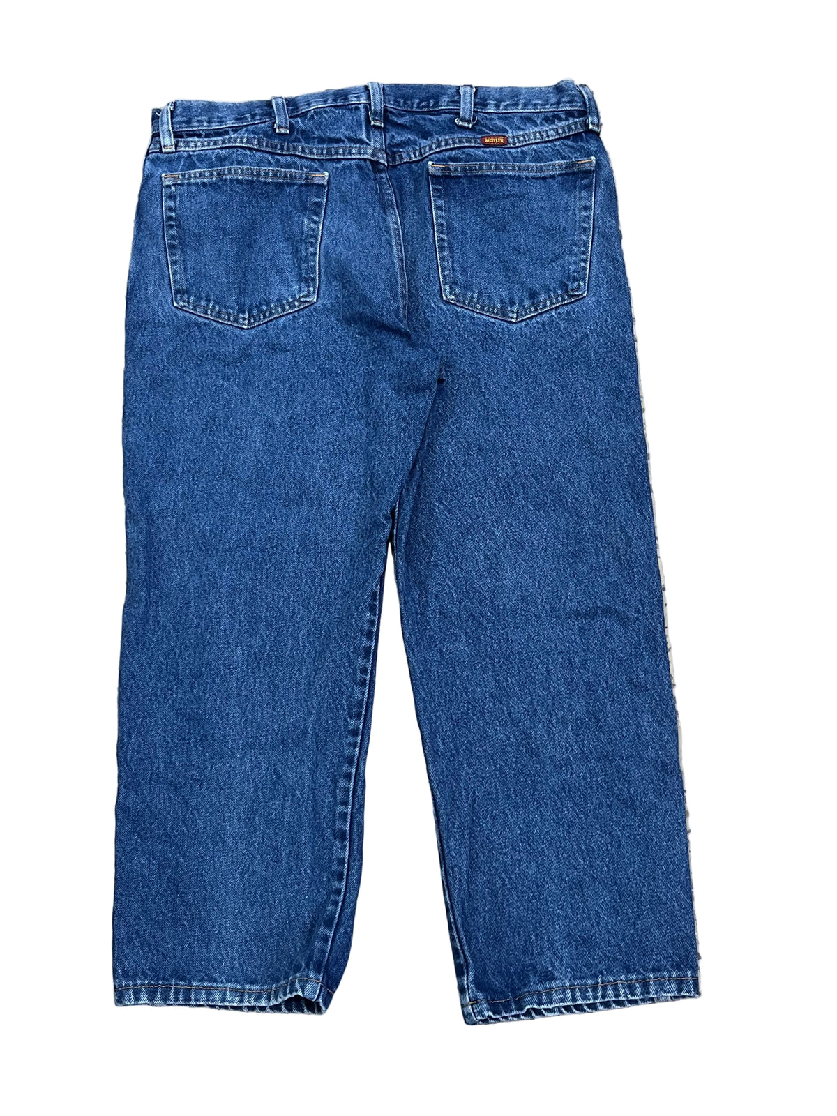 Back view of a pair of blue denim jeans ON THE WHITE BACKGROUND