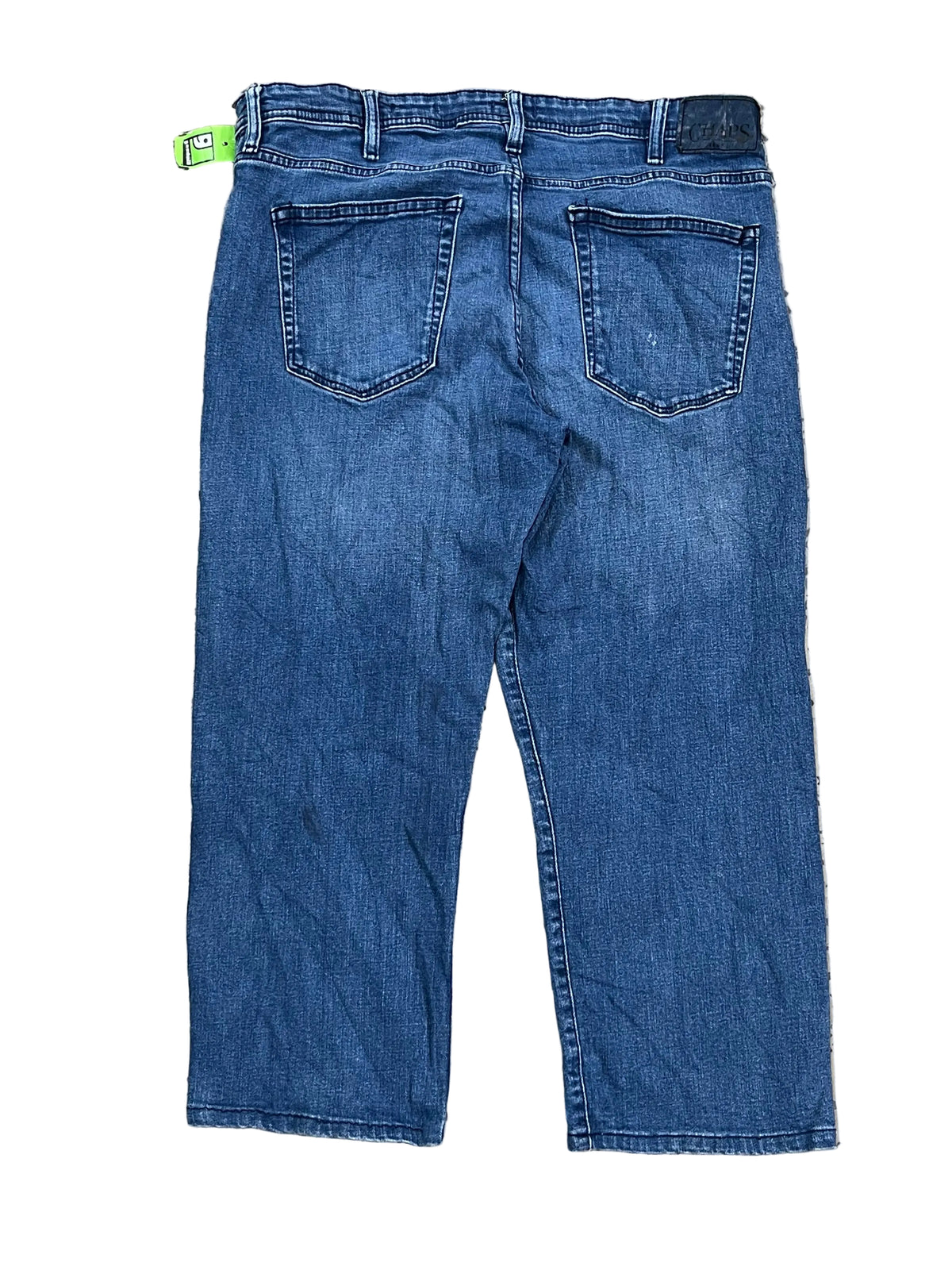 A pair of blue denim jeans  showing the back pockets and waistband.