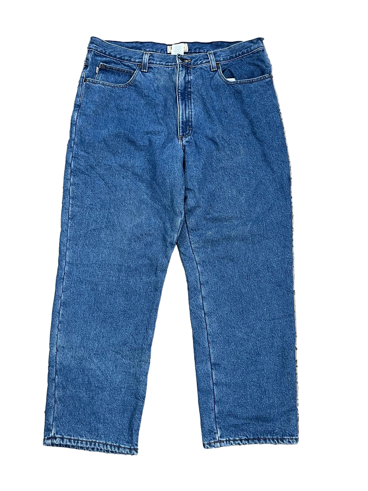 A pair of blue denim jeans ON THE WHITE BACKGROUND