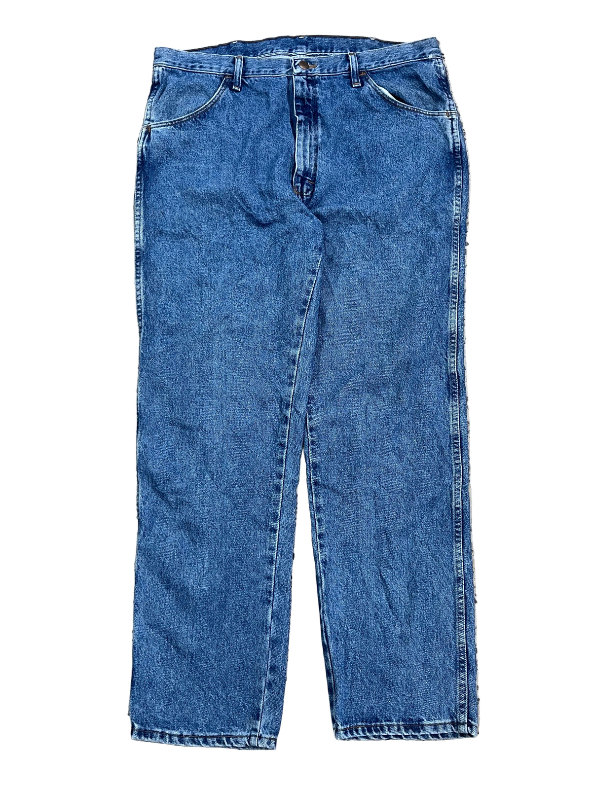 A pair of medium wash blue denim jeans ON THE WHITE BACKGROUND