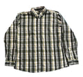 A long-sleeve plaid button-up shirt , with bare feet visible at the bottom edge.