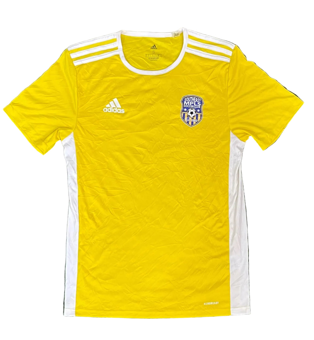 A yellow Adidas soccer jersey with white shoulder stripes, white side panels, and a blue and white Mexico national team crest on the chest