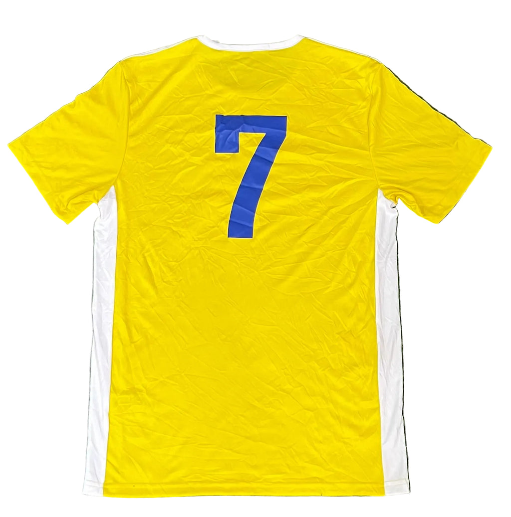A yellow short-sleeve soccer jersey  showing the back with a large blue number 7 and white side panels.