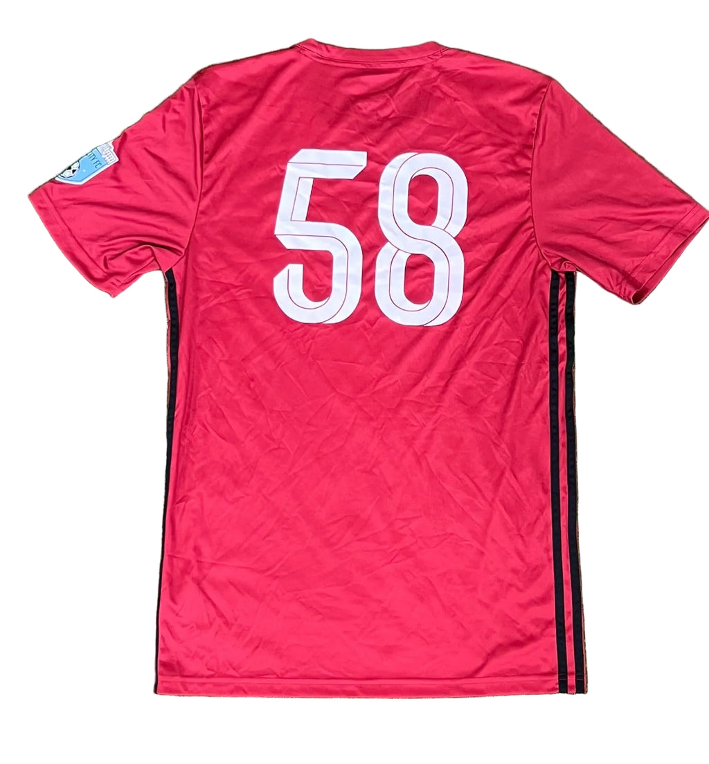 A red short-sleeve soccer jersey shown from the back,. The back features the number 58 in large white block letters with a black outline, and black side stripes run down the sides.