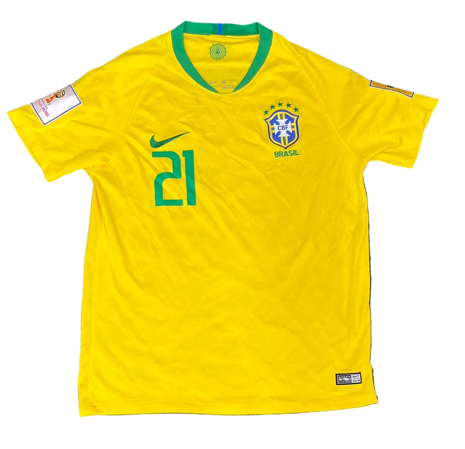 A yellow Brazil national team soccer jersey with green trim, featuring the number 21 on the right chest, a green Nike swoosh, and the Brazil crest on the left chest, 