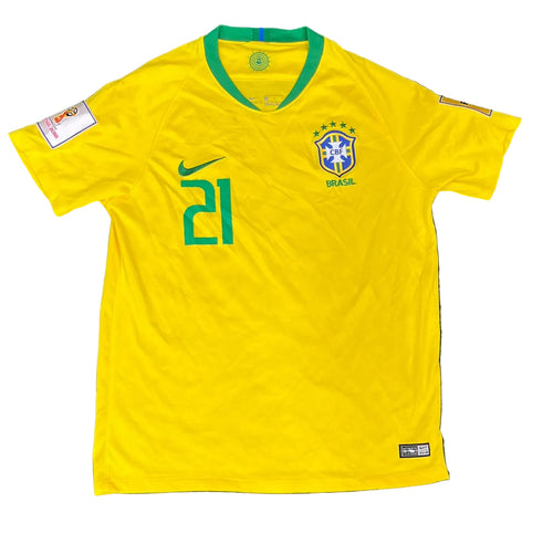 A yellow Brazil national team soccer jersey with green trim, featuring the number 21 on the right chest, a green Nike swoosh, and the Brazil crest on the left chest, 