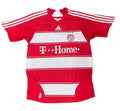 A red and white striped Adidas Bayern Munich soccer jersey with 'T-Home' sponsor branding