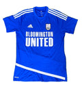 A royal blue Adidas Bloomington United soccer jersey The jersey features white shoulder stripes, a white Adidas logo on the right chest, a white BISC club crest on the left chest, and 'BLOOMINGTON UNITED' printed in large white letters across the front.