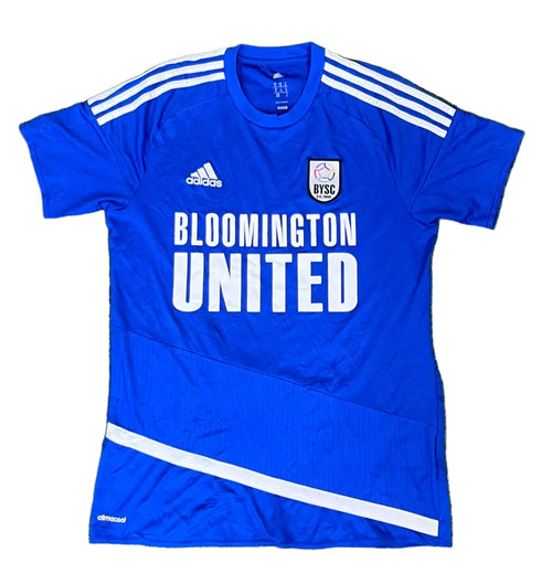 A royal blue Adidas Bloomington United soccer jersey The jersey features white shoulder stripes, a white Adidas logo on the right chest, a white BISC club crest on the left chest, and 'BLOOMINGTON UNITED' printed in large white letters across the front.