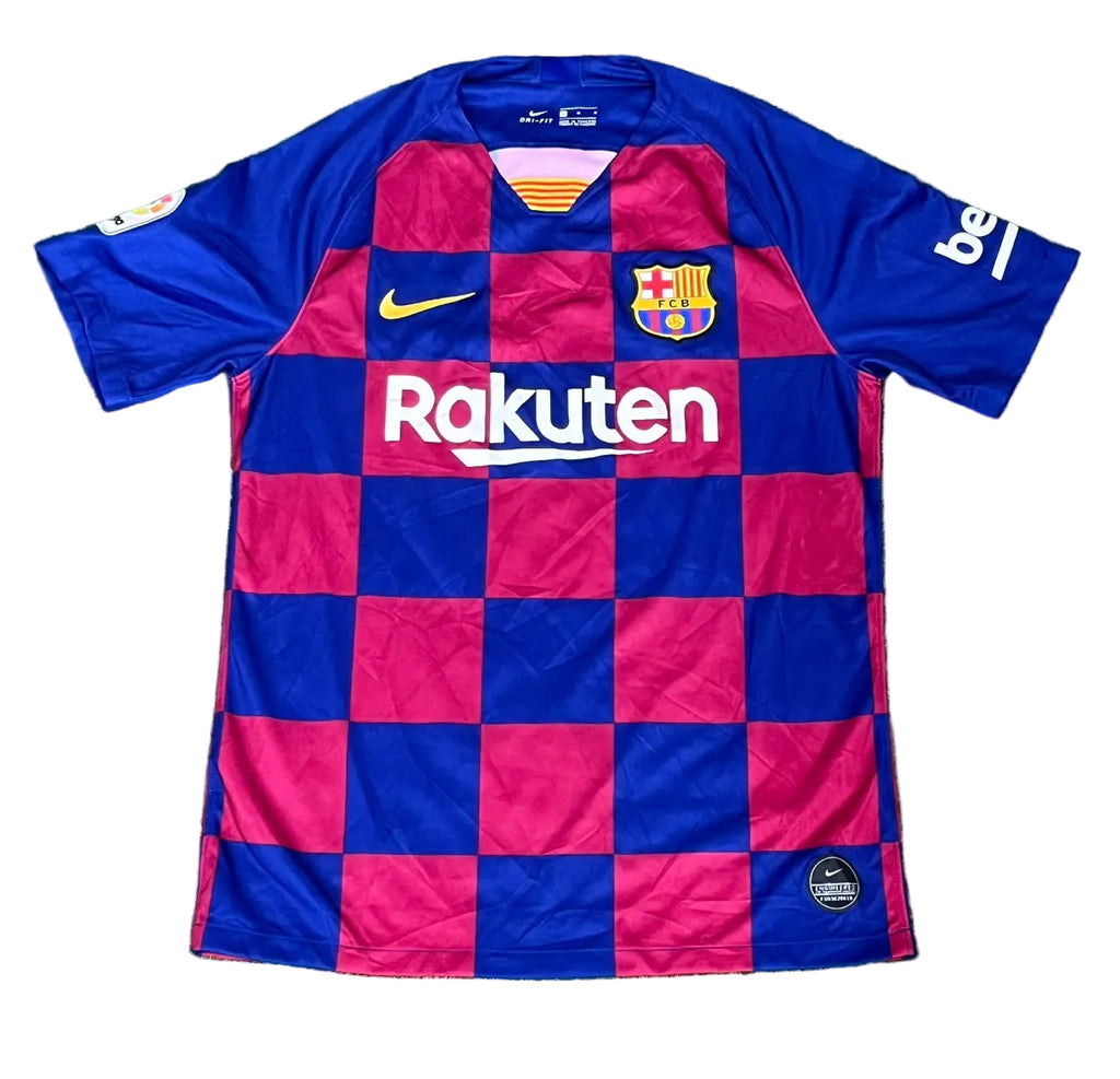 A vintage FC Barcelona home soccer jersey with a blue and magenta checkered pattern, featuring the Nike swoosh, FC Barcelona crest, and Rakuten sponsor logo, 